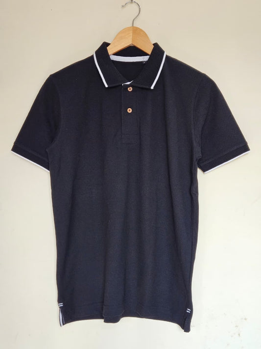 black polo t shirt white tipping India
cotton polo t shirt black classic fit
minimal polo t shirt smart casual style
black polo with contrast collar design
premium cotton polo t shirt men women