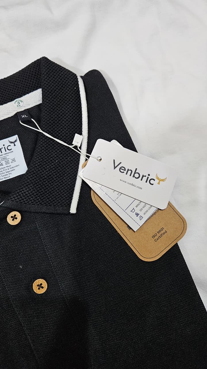 black polo t shirt white tipping India
cotton polo t shirt black classic fit
minimal polo t shirt smart casual style
black polo with contrast collar design
premium cotton polo t shirt men women