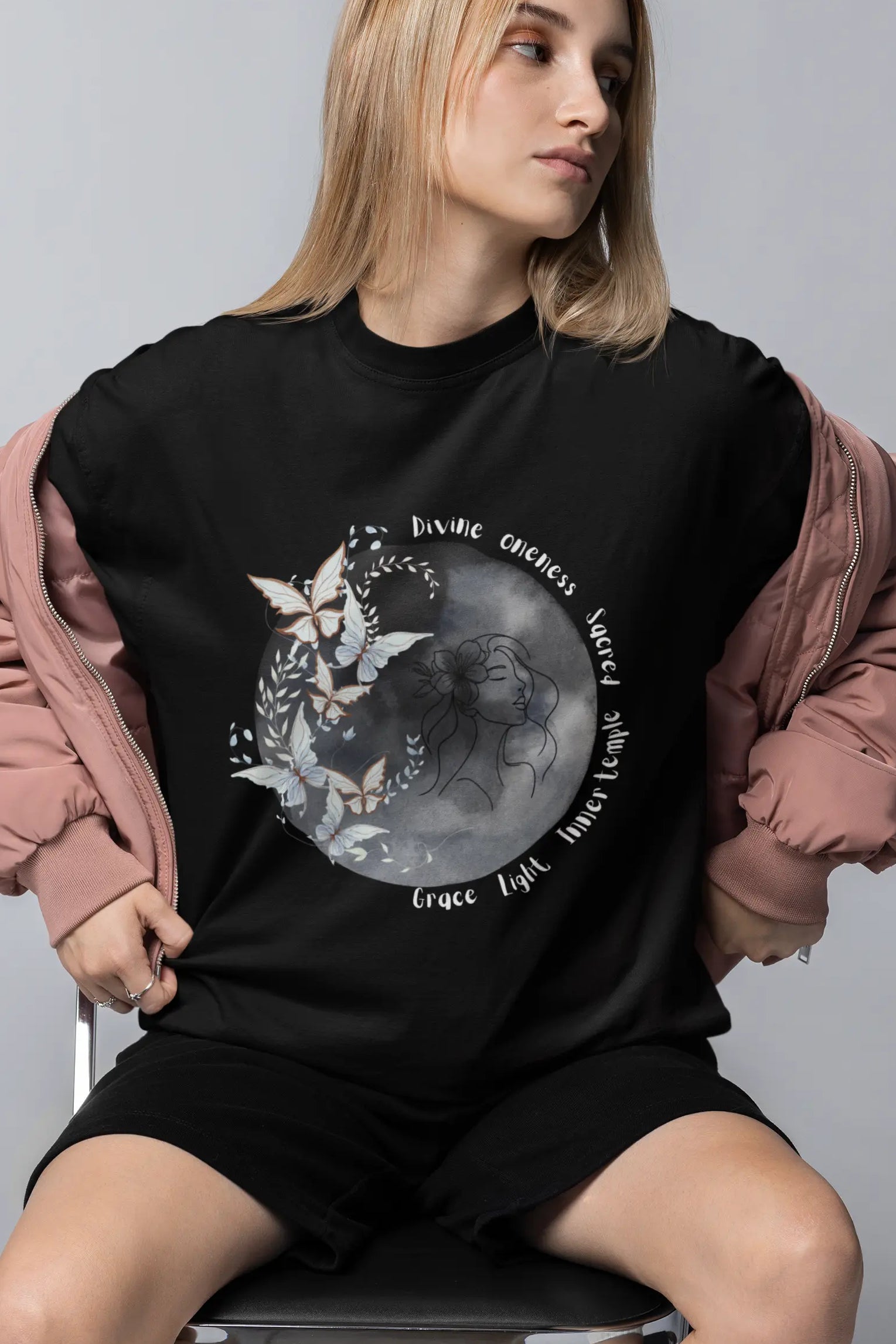 Celestial moon graphic oversized black t-shirt for women front view