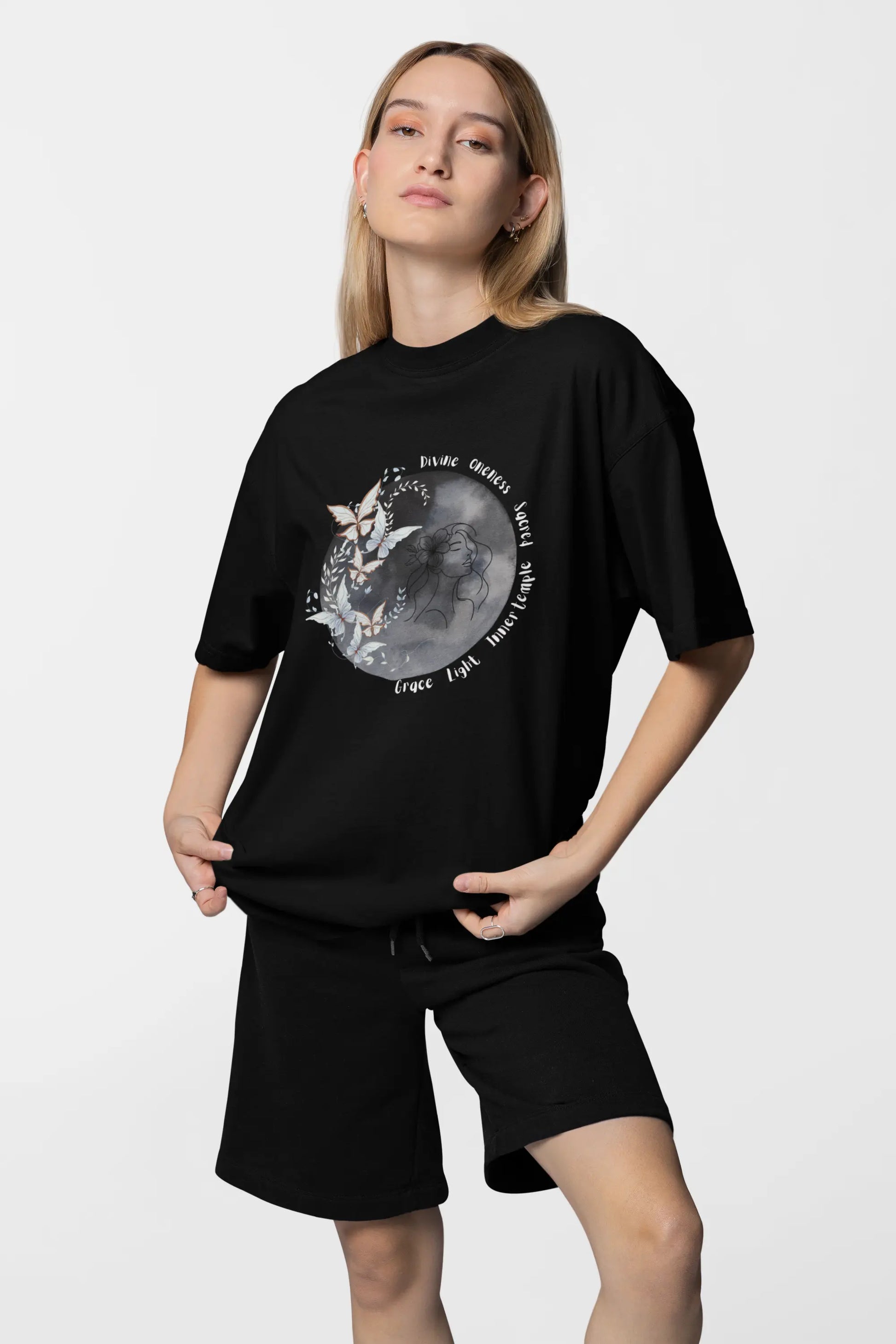 Woman wearing celestial moon oversized t-shirt aesthetic outfit