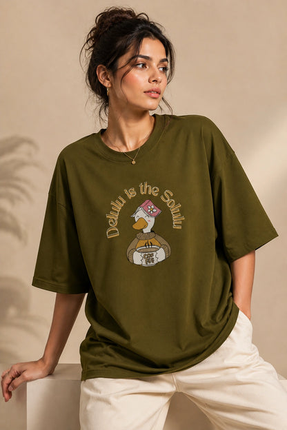 Female model wearing Delulu Is The Solulu olive green unisex graphic streetwear T-shirt made from premium 240 GSM cotton