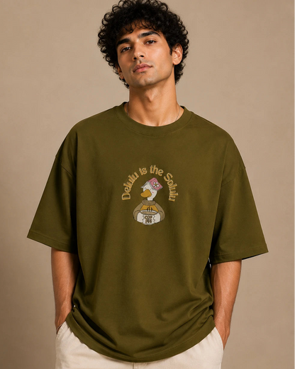 Male model wearing Delulu Is The Solulu olive green unisex graphic streetwear T-shirt made from premium 240 GSM cotton