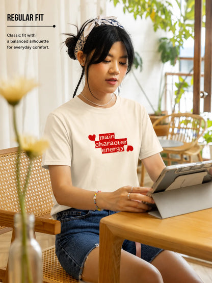 Woman wearing Main Character Energy regular fit graphic tee in off white